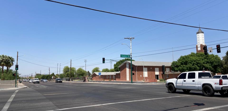A single truck waits to make a left turn at Seventh and Southern avenues in Phoenix on April 27, 2022. Most directions don't have a turn arrow. Residents say the intersection is dangerous because drivers often have to wait until the light is red to turn.