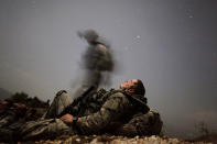 <p>A U.S. soldier of 2-12 Infantry 4BCT-4ID Task Force Mountain Warrior takes a break during a night mission near Honaker Miracle camp at the Pesh valley of Kunar Province, on Aug. 12, 2009. (Photo: Carlos Barria/Reuters) </p>