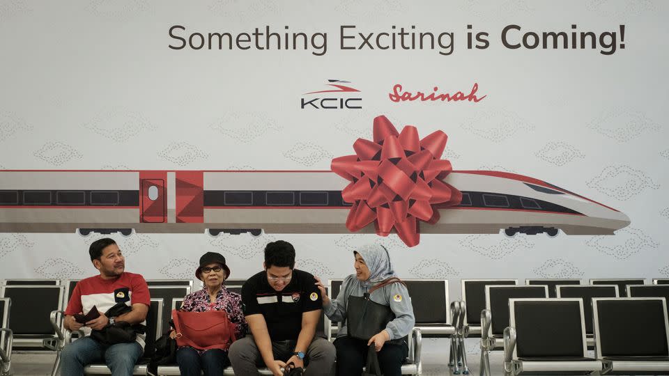 Passengers sit at the Halim station in Jakarta. - Yasuyoshi Chiba/AFP/Getty Images