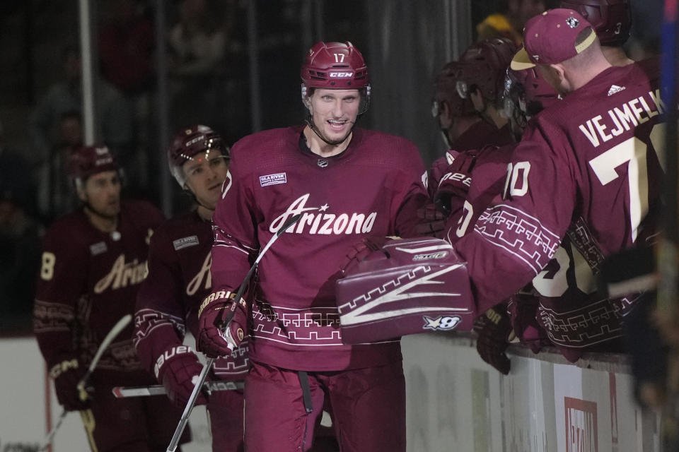 Arizona Coyotes center Nick Bjugstad (17) is congratulated for a goal against the Nashville Predators during the second period of an NHL hockey game Thursday, March 28, 2024, in Tempe, Ariz. (AP Photo/Rick Scuteri)