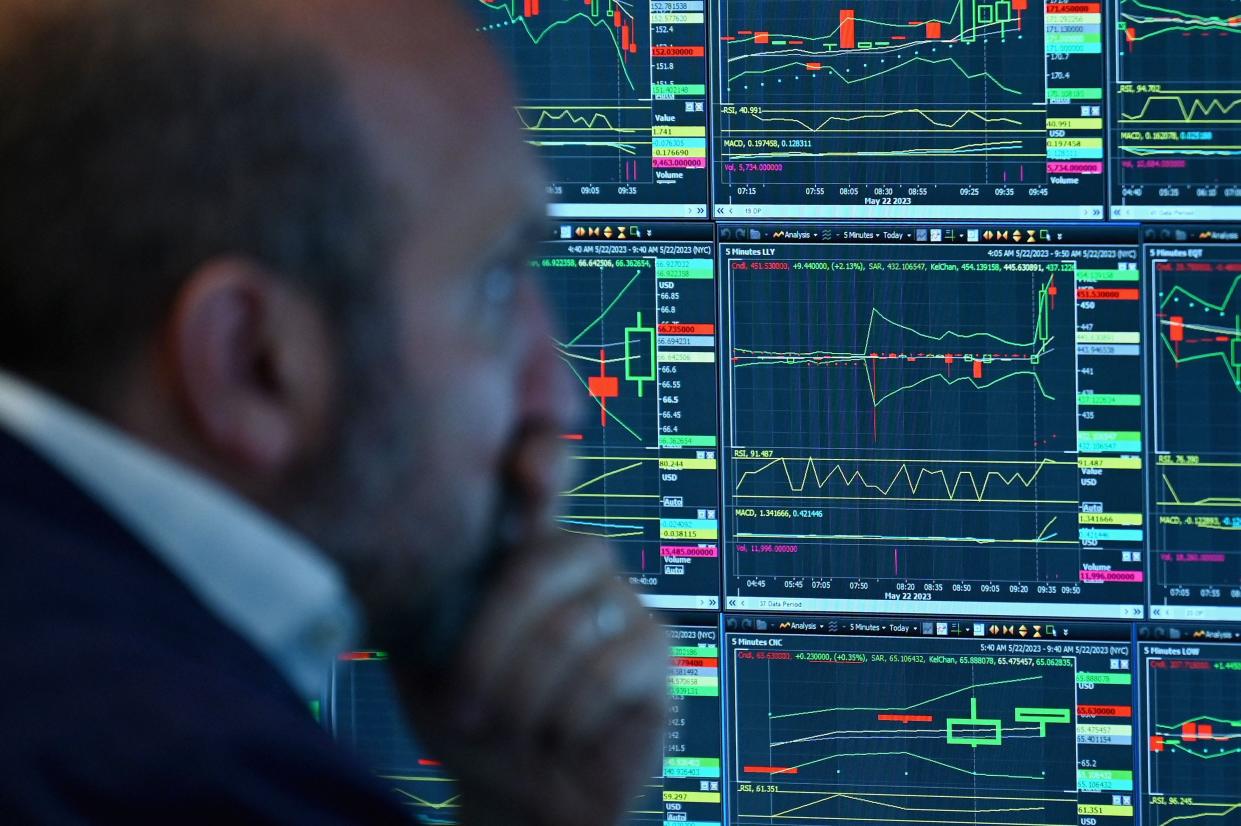 A trader on the floor at the New York Stock Exchange (NYSE) in New York during the opening bell on May 22, 2023.