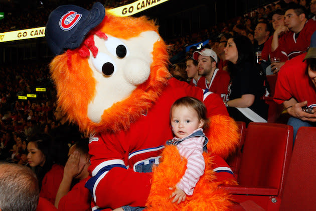 MONTREAL- MAY 12: Youppi, the Montreal Canadiens mascot holds a young fan during Game Seven of the Eastern Conference Semifinals between the Montreal Canadiens and the Pittsburgh Penguins during the 2010 NHL Stanley Cup Playoffs at the Bell Centre on May 12, 2010 in Montreal, Quebec, Canada. (Photo by Richard Wolowicz/Getty Images)