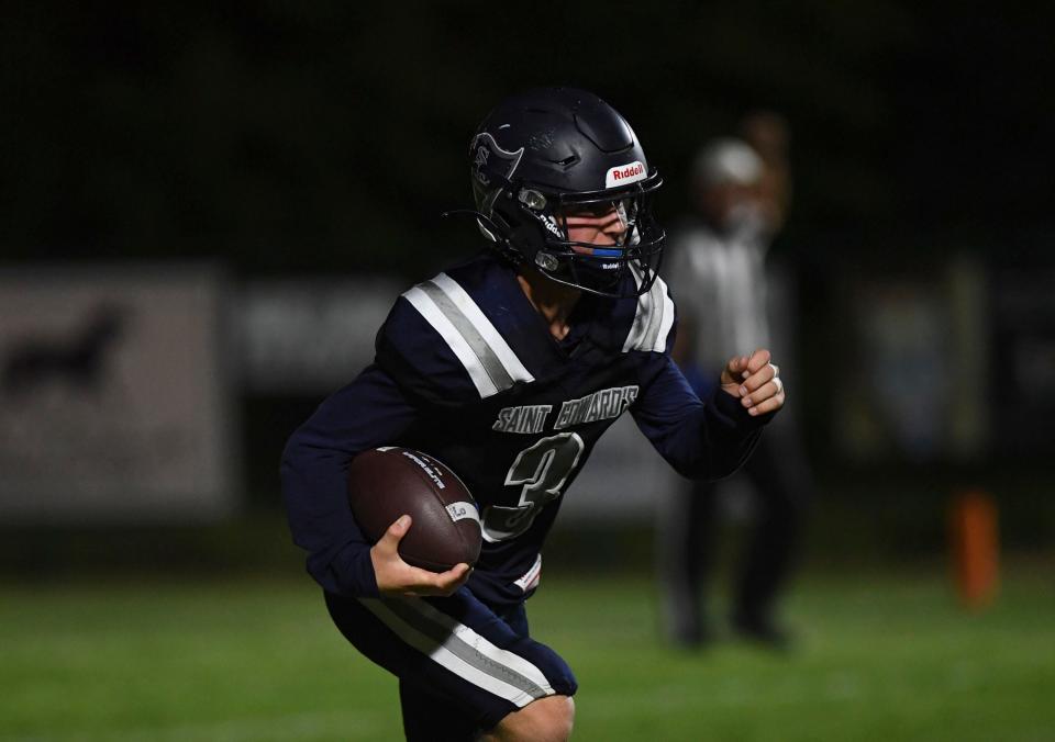 St. Edward’s Connor O’Brien (3) runs the ball against Cocoa Beach in a high school football game, Friday, Oct. 6, 2023. St. Edward’s won 27-20.