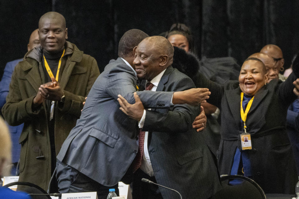 African National Congress lawmakers and South African président Cyril Ramaphosa react after his being reelected as leader of the country in Cape Town, South Africa, Friday, June 14, 2024. (AP Photo/Jerome Delay)