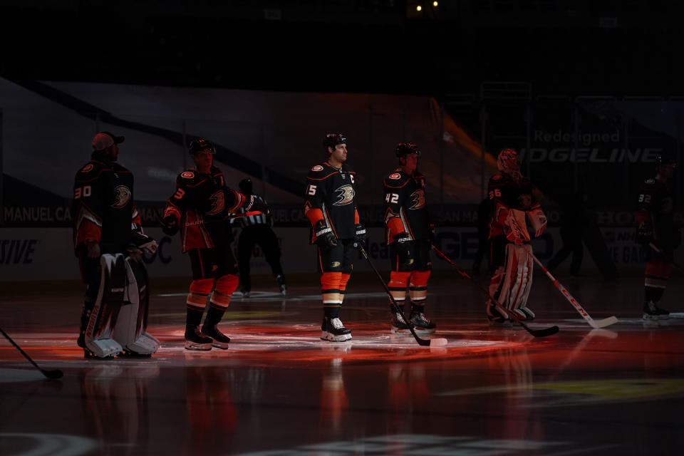 The Anaheim Ducks are introduced before an NHL hockey game against the Minnesota Wild Monday, Jan. 18, 2021, in Anaheim, Calif. (AP Photo/Marcio Jose Sanchez)