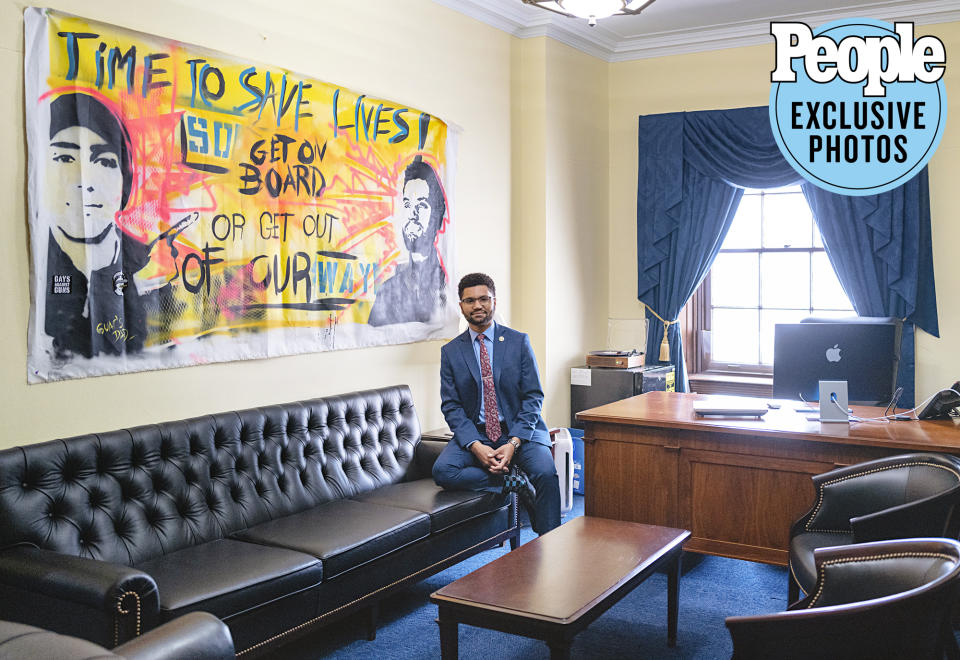 <p>The congressman's staff has big plans for his office decor, hoping to "Florida it up" with artwork that feels like home. Before commissioning the art, though, Frost set up the basics.</p> <p>On top of a mini-fridge beside his desk sits a record player, where Frost spins some of his favorite vinyl throughout the day. Also in his office is a sentimental calendar he received as a Christmas gift from his younger sister that's equal parts emotional and fun. It's of his grandma, Yeya, one of his biggest inspirations who died weeks before <a href="https://people.com/politics/maxwell-frost-elected-first-gen-z-member-congress/" rel="nofollow noopener" target="_blank" data-ylk="slk:his election;elm:context_link;itc:0;sec:content-canvas" class="link ">his election</a> at the age of 97. "Each month is different pictures of her eating," he explains. "We would go to restaurants and she would get a full branzino and eat the whole dang thing ... It was always a joke in our family that 'Yeya eats the most.'"</p> <p>And then there's the most notable piece of artwork, a larger than life banner handmade by <a href="https://people.com/crime/parents-parkland-shooting-victim-unveil-mural-honoring-lives-lost/" rel="nofollow noopener" target="_blank" data-ylk="slk:Manuel Oliver;elm:context_link;itc:0;sec:content-canvas" class="link ">Manuel Oliver</a>, whose son, Joaquin, was killed in the <a href="https://people.com/tag/florida-high-school-shooting/" rel="nofollow noopener" target="_blank" data-ylk="slk:2017 Parkland school shooting;elm:context_link;itc:0;sec:content-canvas" class="link ">2017 Parkland school shooting</a>. The painting depicts Joaquin and Frost, with the words, "Time to save lives! Get on board or get out of our way!" (Before running for Congress, Frost served as national organizer for <a href="https://people.com/crime/march-for-our-lives-march-24-teen-survivors-florida-school-shooting/" rel="nofollow noopener" target="_blank" data-ylk="slk:March for Our Lives;elm:context_link;itc:0;sec:content-canvas" class="link ">March for Our Lives</a>, a youth-led organization formed to prevent further gun violence in the wake of Parkland.)</p>