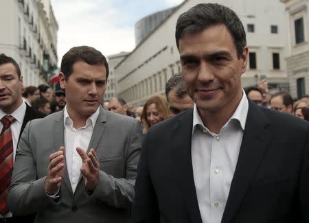 Ciudadanos Party leader Albert Rivera (L) and Socialist Party (PSOE) leader Pedro Sanchez walk next to each other during an event at Spanish parliament in Madrid, Spain, April 21, 2016. REUTERS/Andrea Comas