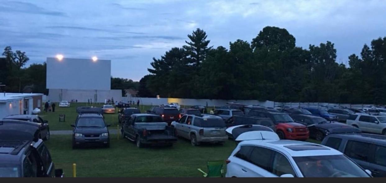 Visitors wait at dusk for a movie to begin at Hartford's Sunset Drive In.