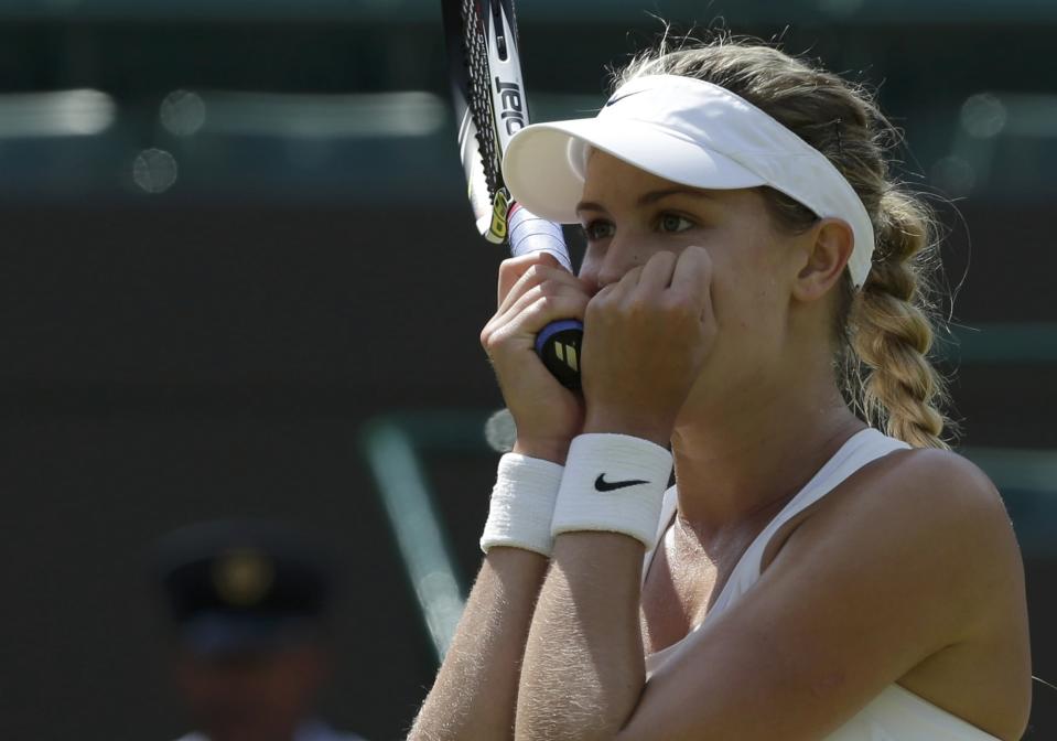 Eugenie Bouchard of Canada reacts after defeating Angelique Kerber of Germany in their women's singles quarter-final tennis match at the Wimbledon Tennis Championships, in London July 2, 2014. REUTERS/Max Rossi (BRITAIN - Tags: SPORT TENNIS)