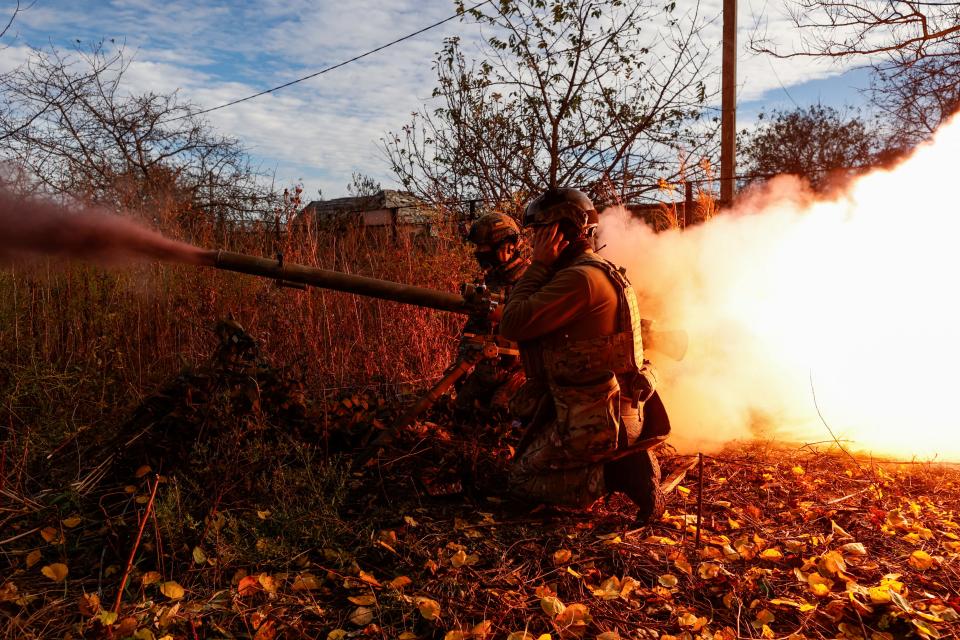 Members of Ukraine's National Guard Omega Special Purpose fire a SPG-9 anti-tank grenade launcher toward Russian troops in the front line town of Avdiivka.