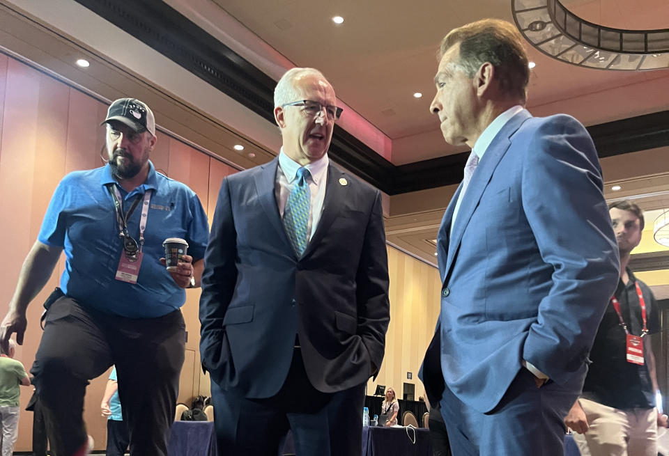 SEC commissioner Greg Sankey talks with Nick Saban during SEC media days on Monday. (Yahoo Sports)