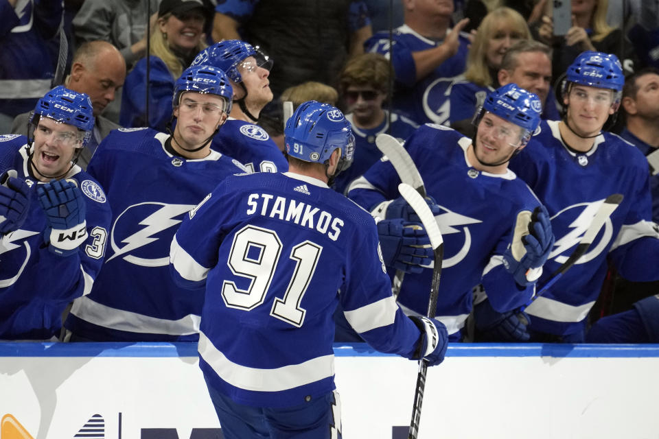 Tampa Bay Lightning center Steven Stamkos (91) celebrates with the bench after scoring against the Philadelphia Flyers during the second period of an NHL hockey game Tuesday, Oct. 18, 2022, in Tampa, Fla. (AP Photo/Chris O'Meara)