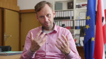 Torsten Kuehne, official in charge of schools in Berlin"s Pankow district talks to the Associated Press during an interview,in Berlin, Germany, Wednesday, Aug. 5, 2020. As Germany's 16 states start sending millions of children back to school in the middle of the global coronavirus pandemic, the country's famous sense of "Ordnung" has been replaced with uncertainty, with a hodgepodge of regional regulations that officials acknowledge may or may not work. (AP Photo/Pietro De Christofaro)