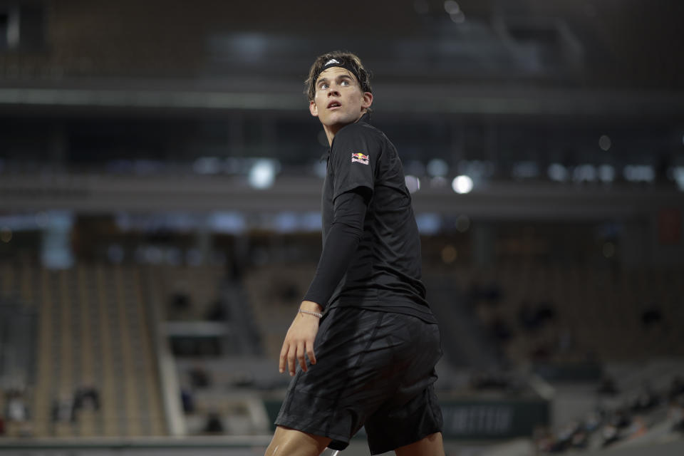 Austria's Dominic Thiem looks back in the first round match of the French Open tennis tournament against Croatia's Marin Cilic at the Roland Garros stadium in Paris, France, Monday, Sept. 28, 2020. (AP Photo/Alessandra Tarantino)