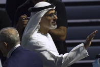 Abu Dhabi Crown Prince Sheikh Khaled bin Mohammed Al Nahyan waves at a summit in Abu Dhabi, United Arab Emirates, Monday, Feb. 26, 2024. The World Trade Organization opened its biennial meeting Monday in the United Arab Emirates as the bloc faces pressure from the United States and other nations ahead of a year of consequential elections around the globe. (AP Photo/Jon Gambrell)