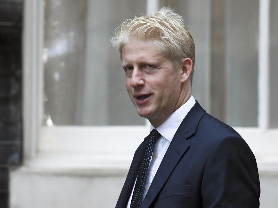 FILE - In this Wednesday, Sept. 4, 2019 file photo, Britain's Conservative Party lawmaker Jo Johnson arrives at Downing Street in London. Jo Johnson has announced he is quitting as an education minister and will step down from Parliament, saying he is “torn between family loyalty and the national interest.” (AP Photo/Alberto Pezzali, File)