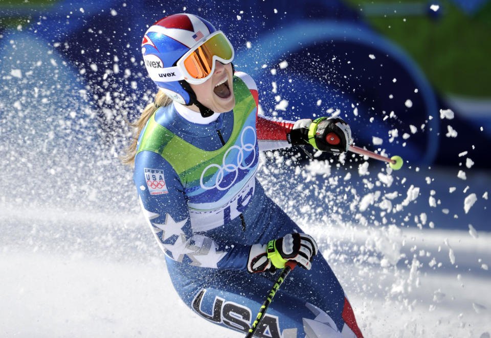 FILE - In this Feb. 17, 2010, file photo, Lindsey Vonn of the United States, reacts in the finish area after completing the Women's downhill at the Vancouver 2010 Olympics in Whistler, British Columbia. Vonn is going to skip the Sochi Olympics because of a right knee injury. Her personal publicist, Lewis Kay, says in a statement Tuesday, Jan. 7, 2014, that Vonn "will have surgery shortly." The 29-year-old American won two medals at the 2010 Vancouver Olympics, including a gold in the downhill. She is also a four-time overall World Cup champion and the biggest name in Alpine skiing. (AP Photo/Gero Breloer, File)