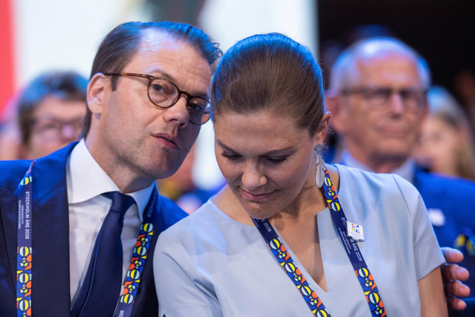 Sweden's Crown Princess Victoria, right, and Prince Daniel, members of the candidate for the Olympic Winter Games 2026 Stockholm-Are delegation, have a word as International Olympic Committee (IOC) president Thomas Bach from Germany announces that Milan-Cortina has won the bid to host the 2026 Winter Olympic Games during the first day of the 134th Session of the International Olympic Committee (IOC), at the SwissTech Convention Centre, in Lausanne, Switzerland June 24, 2019. Jean-Christophe Bott/Pool via REUTERS