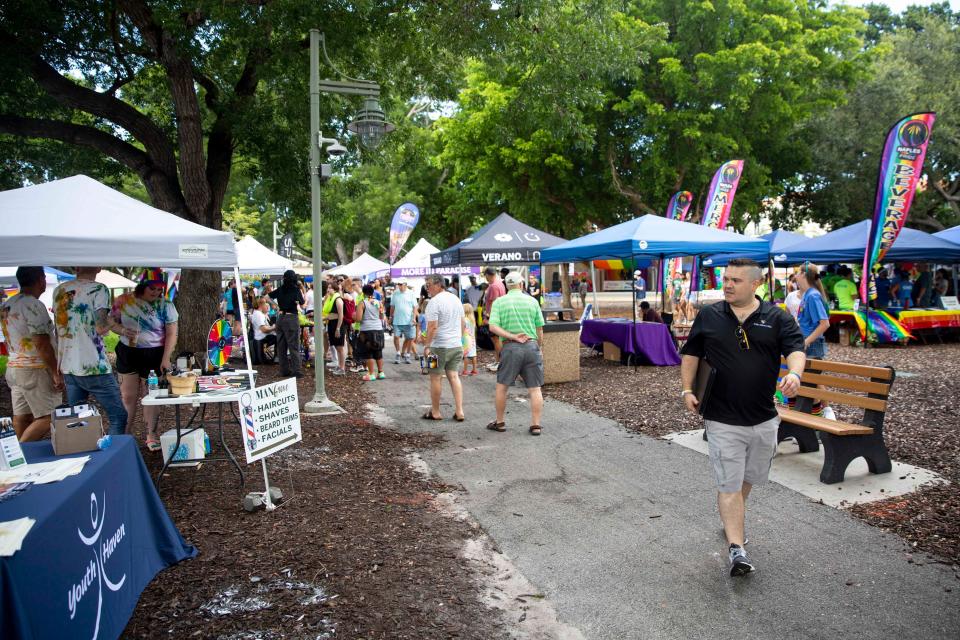 Attendees visit vendor booths during the 4th Annual Naples Pride Fest, Saturday, July 9, 2022, at Cambier Park in Naples, Fla