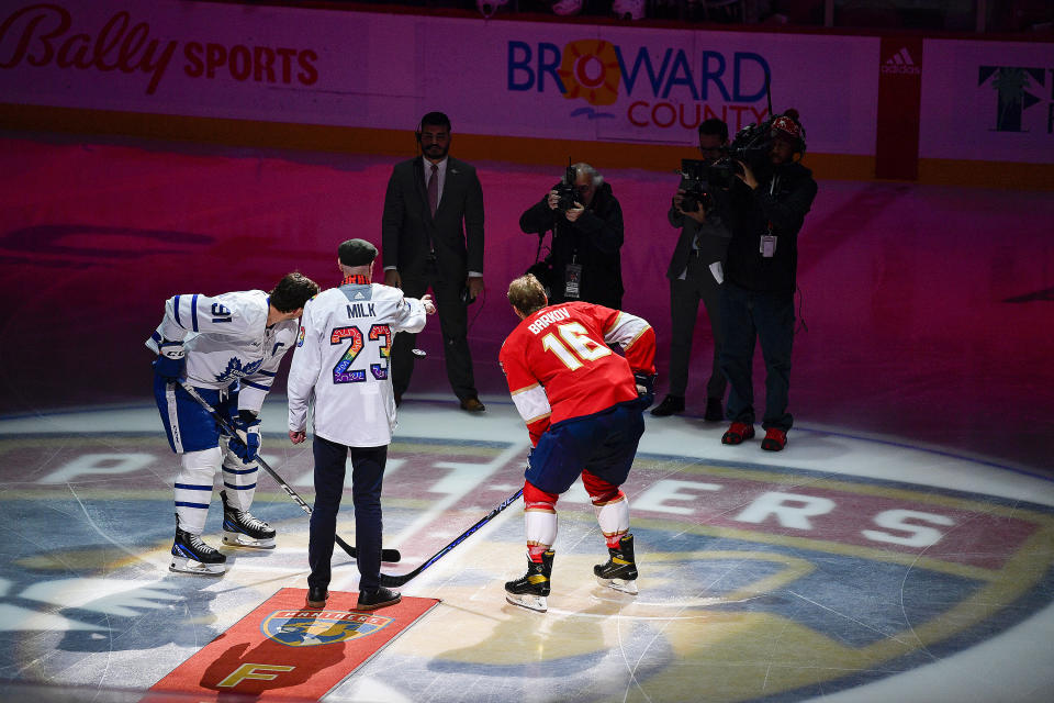 American LGBT human rights activist Stuart Milk drops a puck to celebrate Pride Night as Toronto Maple Leafs center John Tavares and Florida Panthers center Aleksander Barkov (16) participate before the start of an NHL hockey game, Thursday, March 23, 2023, in Sunrise, Fla. (AP Photo/Michael Laughlin)