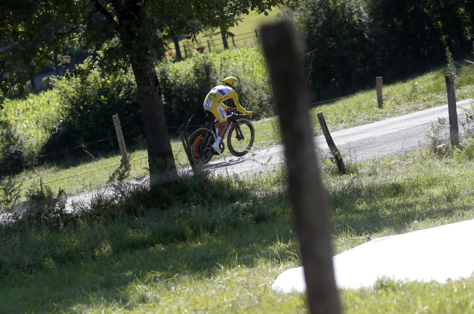 France's Julian Alaphilippe wearing the overall leader's yellow jersey rides during the thirteenth stage of the Tour de France cycling race, an individual time trial over 27.2 kilometers (16.9 miles) with start and finish in Pau, France, Friday, July 19, 2019. (AP Photo/Thibault Camus)