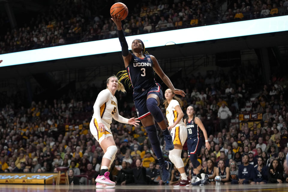UConn forward Aaliyah Edwards (3) goes up for a shot during the second half of an NCAA college basketball game against Minnesota, Sunday, Nov. 19, 2023, in Minneapolis. (AP Photo/Abbie Parr)