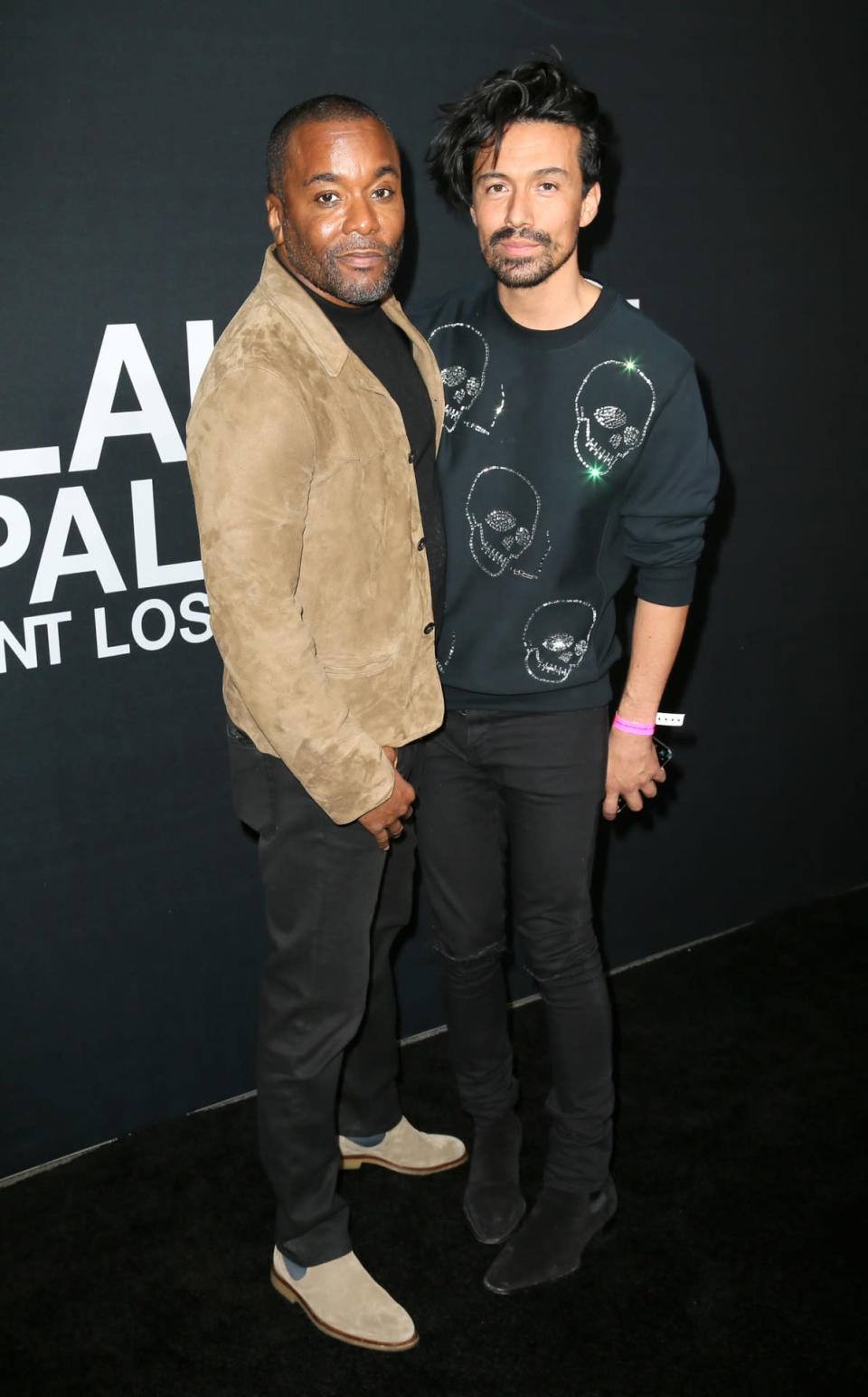Director Lee Daniels with Jahil Fisher at the Saint Laurent show. 