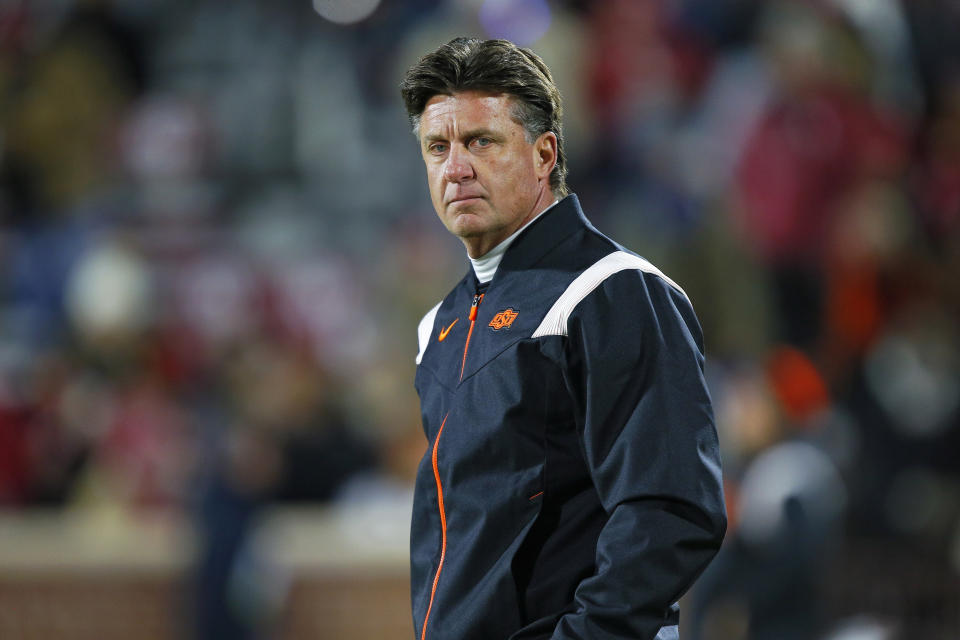 NORMAN, OK - NOVEMBER 19:  Head coach Mike Gundy of the Oklahoma State Cowboys walks around the field before Bedlam against the Oklahoma Sooners at Gaylord Family Oklahoma Memorial Stadium on November 19, 2022 in Norman, Oklahoma.  The Sooners won 28-13.  (Photo by Brian Bahr/Getty Images)