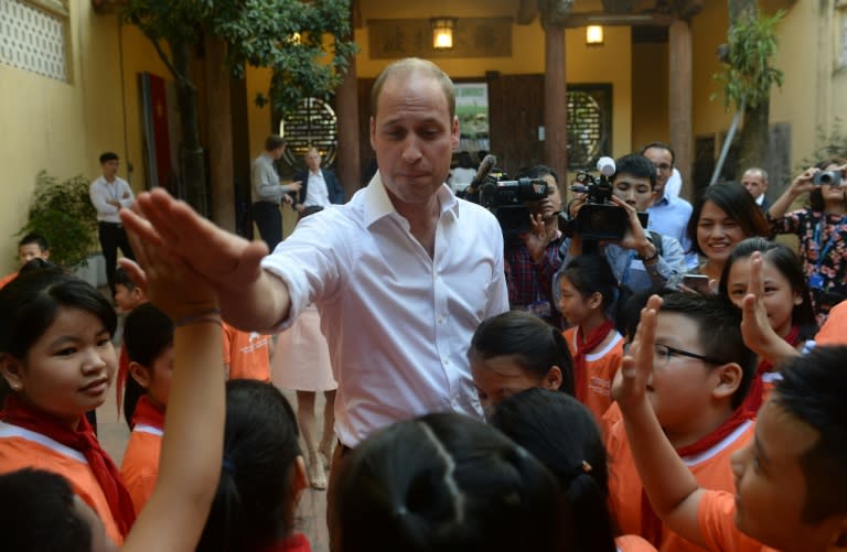 Britain's Prince William, Duke of Cambridge chats to pupils at a local primary school in downtown Hanoi on November 16, 2016