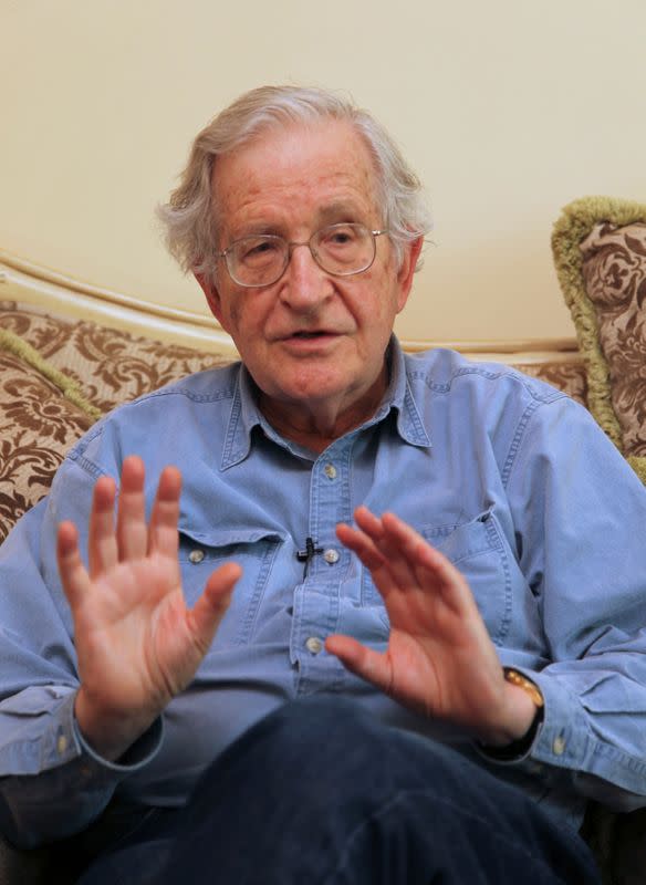 Noam Chomsky, a leading American intellectual highly critical of Israel's policies toward the Palestinians, gestures in Amman