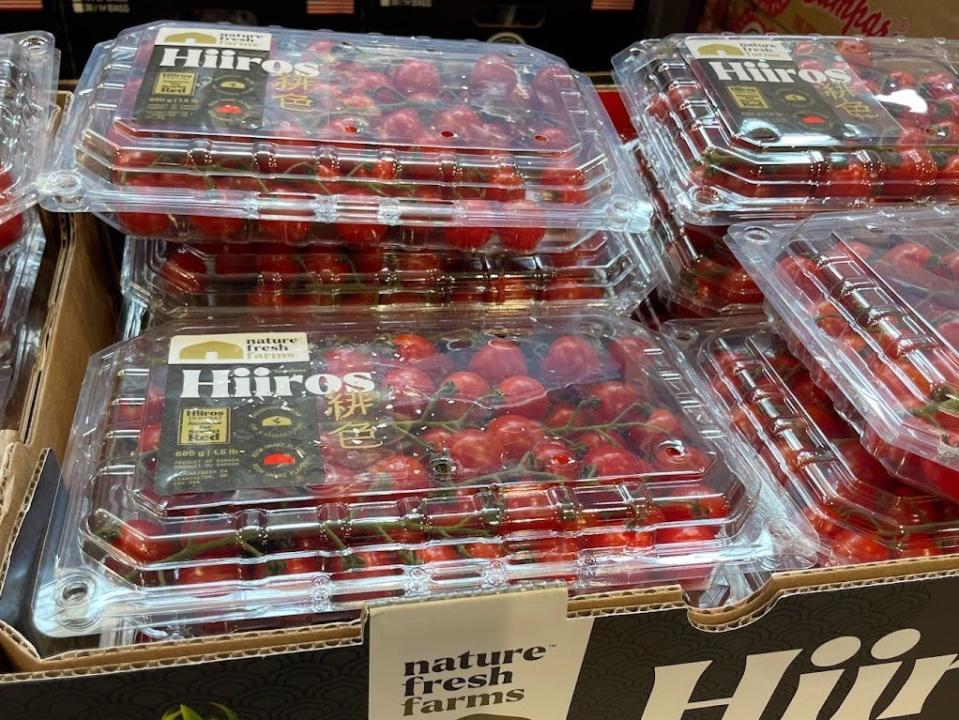 Large containers of Hiiros cherry tomatoes.