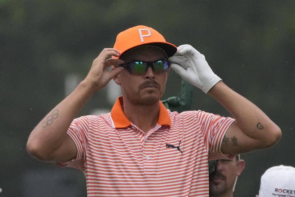 Rickie Fowler prepares to drive off the second tee during the final round of the Rocket Mortgage Classic golf tournament at Detroit Country Club, Sunday, July 2, 2023, in Detroit. (AP Photo/Carlos Osorio)