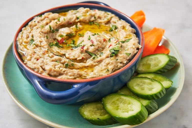 <p>We like our baba ghanoush GARLICKY. If you don't, skip grating the raw clove in at the end. Without it, you'll have a more subtle (slightly sweet) garlic flavour that will make everyone very, very happy. Accompanied by crudités and pita chips, you really can't go wrong. </p><p>Get the <a href="https://www.delish.com/uk/cooking/recipes/a29947311/baba-ghanoush-recipe/" rel="nofollow noopener" target="_blank" data-ylk="slk:Baba Ghanoush" class="link ">Baba Ghanoush</a> recipe.</p>