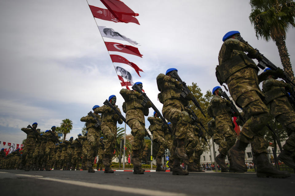 Turkey's army soldiers parade as part of celebrations marking the 100th anniversary of the creation of the modern, secular Turkish Republic, in Istanbul, Turkey, Sunday, Oct. 29, 2023. (AP Photo/Emrah Gurel)