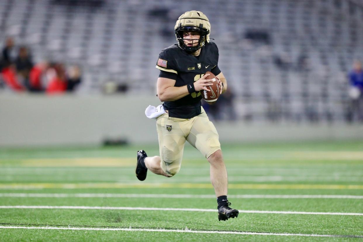 Army quarterback Cale Hellums (3), a rising sophomore, rolls out during the Black-and-Gold football scrimmage at West Point's Michie Stadium on April 12, 2024. DANNY WILD