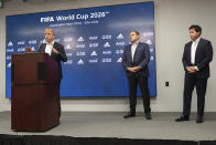 Colin Smith, FIFA Chief Tournaments & Events Officer, answers a question during a press conference Friday afternoon, Sept. 17, 2021 at Mercedes-Benz Stadium in Atlanta, as Victor Montagliani, FIFA vice-president and CONCACAF president, center, and Dan Corso, president of Atlanta Sports Council listen. Officials were touring the stadium as part of the FIFA World Cup 2026 Candidate Host City Tour. (AP Photo/Ben Gray)