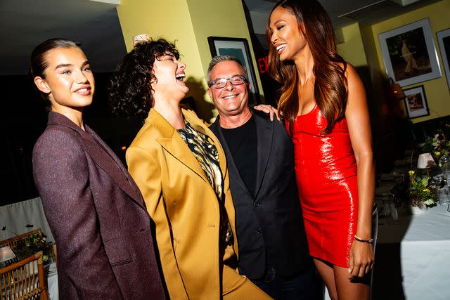 <p>Lexie Moreland/WWD via Getty Images</p> Ivan Bart with models Meghan Roche, Shalom Harlow and Joan Smalls in September 2022.