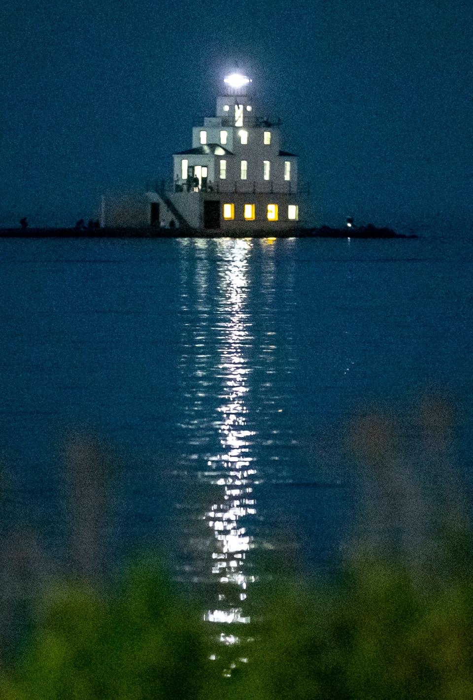 The Manitowoc lighthouse glows in the evening light, Saturday, July 9, 2022, in Manitowoc, Wis.