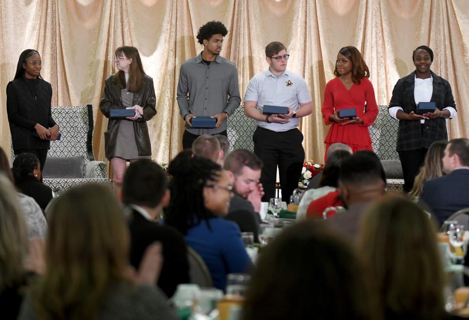 McCollum Scholarship recipient Paris Stokes, left, and Gene DeChellis Scholarship recipients Tess Rosler, Keith McLeod, Brayden Geier, Celebrity Brown and Ava Brown are acknowledged during the 30th annual MLK Mayors' Breakfast.