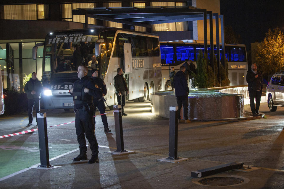 Kosovo police officers secure the hotel where Israel's national soccer team are staying, in the capital Pristina Friday, Nov. 10, 2023. Israel’s national soccer team has arrived in Kosovo amid tight security measures at the airport ahead of a postponed European Championship qualifier. (AP Photo/Visar Kryeziu)