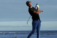 Adam Svensson watches his shot from the 17th tee during the first round of the Sony Open golf tournament Thursday, Jan. 10, 2019, at Waialae Country Club in Honolulu. (AP Photo/Matt York)