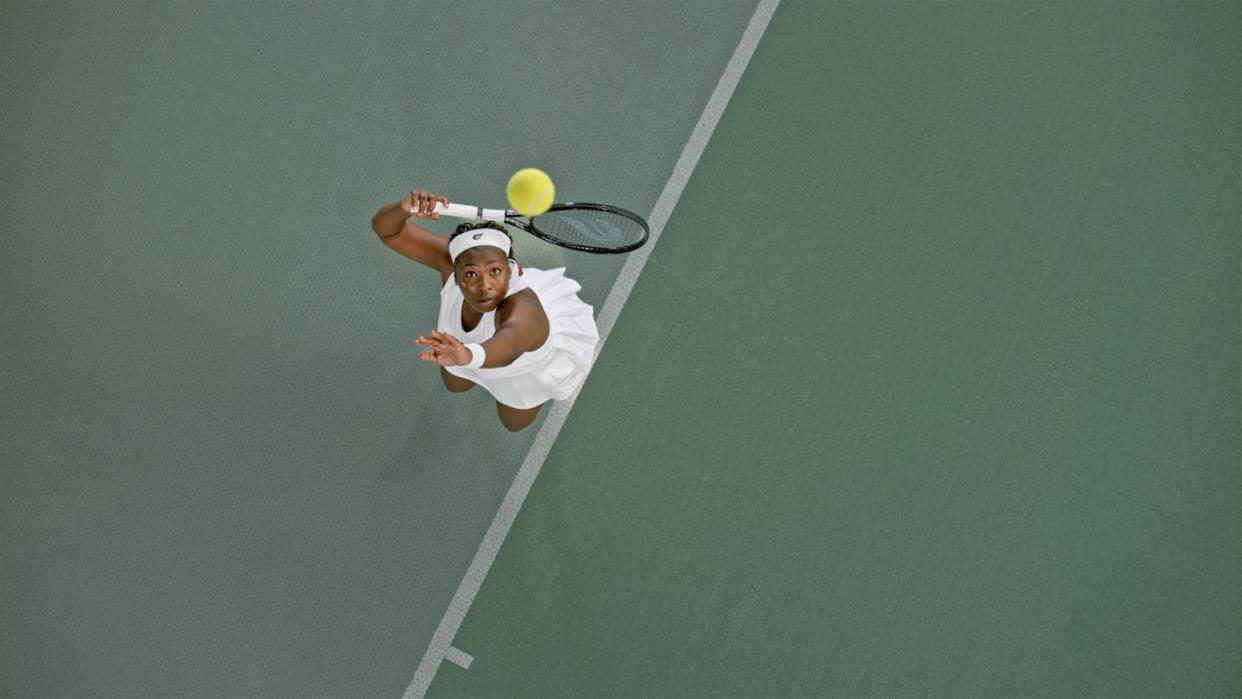 tennis player playing in tennis court