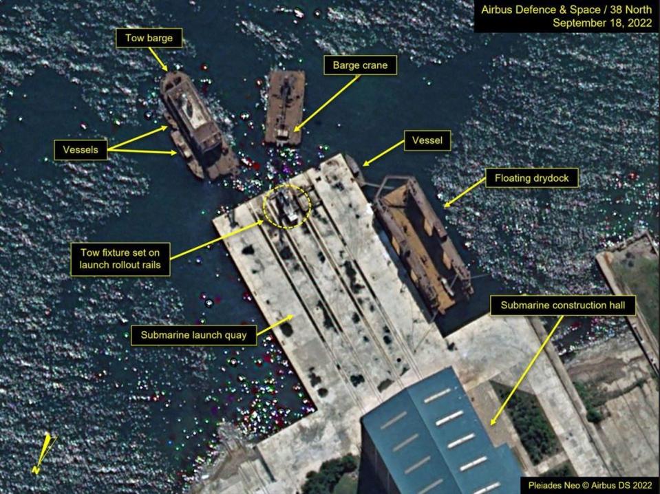 Satellite image shows six barges and vessels gathered around the construction hall quay at the Sinpho South Shipyard in North Korea (Pleiades Neo © Airbus DS 2022)