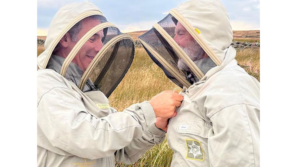 Robson Green and his uncle Matheson wearing beekeeper's outfits