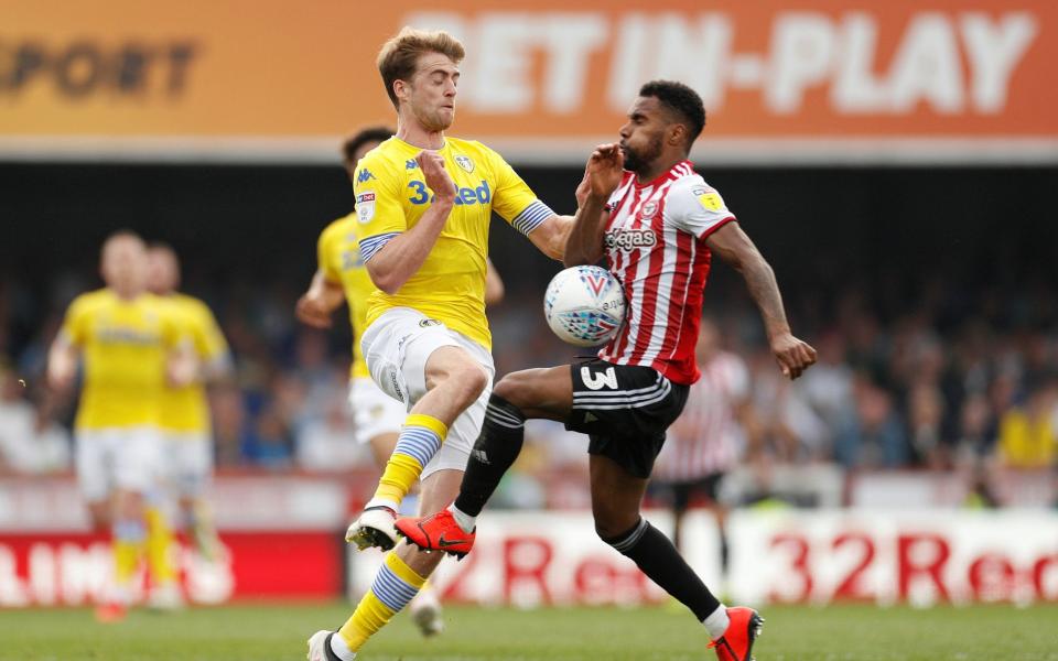 Leeds United's Patrick Bamford in action with Brentford's Rico Henry - Action Images