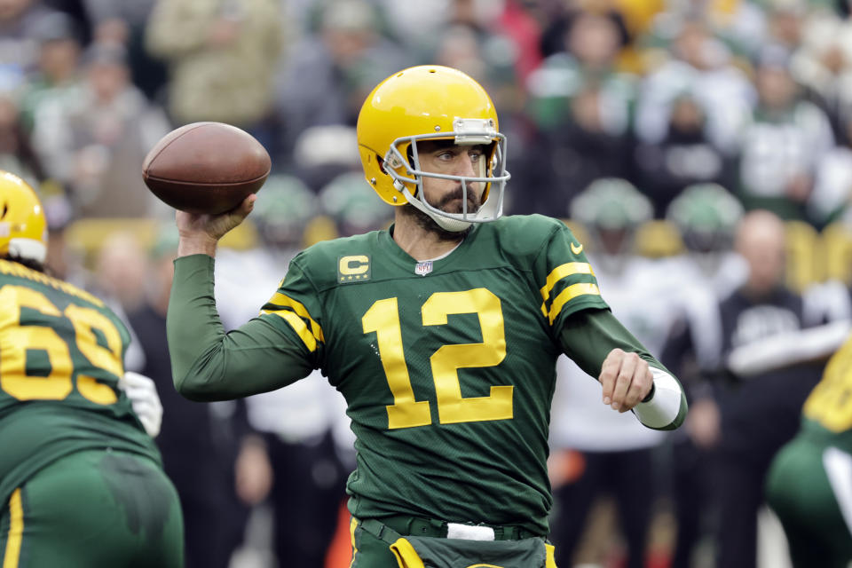 Green Bay Packers quarterback Aaron Rodgers throws during the first half of an NFL football game against the New York Jets, Sunday, Oct. 16, 2022, in Green Bay, Wis. (AP Photo/Mike Roemer)