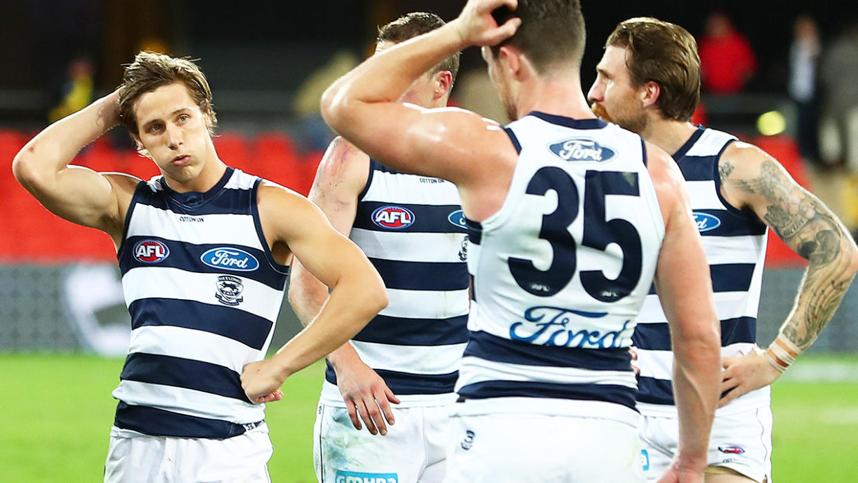 Geelong players, pictured here looking dejected after their loss to Richmond.