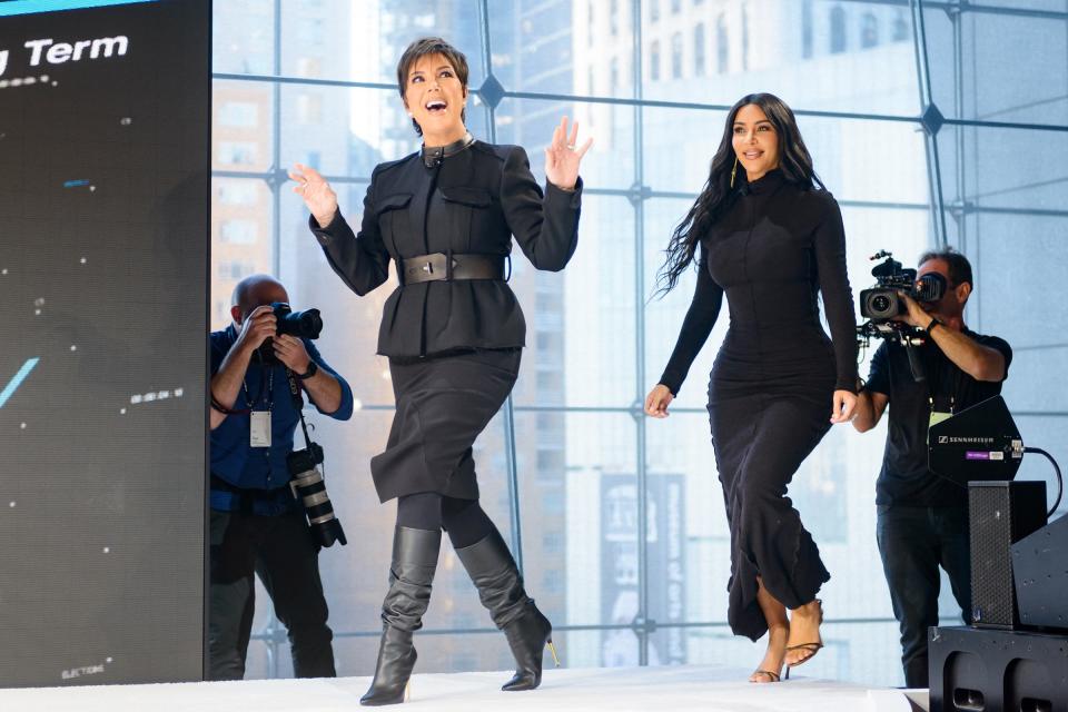 One day after celebrating her birthday, Kris Jenner makes a grand entrance alongside daughter Kim Kardashian West to speak at the 2019 <em>New York Times</em> Dealbook event on Wednesday in N.Y.C. 