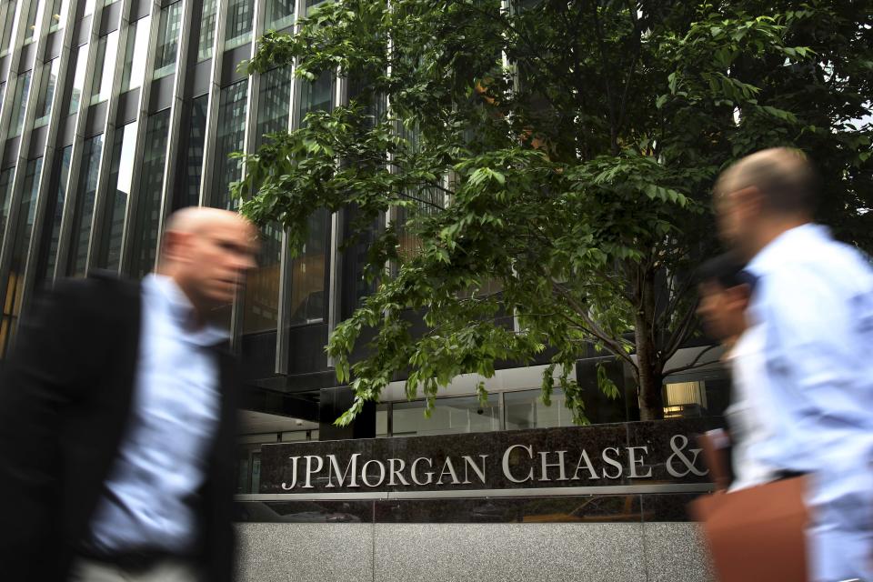 Pedestrians walk past JPMorgan Chase headquarters in New York, Wednesday, May 16, 2012. U.S. House Republican Rep. Shelly Moore Capito, chairman of the House Financial Services subcommittee, on Wednesday said that the $2 billion trading loss at JPMorgan Chase raises critical questions about how banks control their risks. But Republican lawmakers rejected calls from Democrats for stricter oversight of Wall Street. (AP Photo/Seth Wenig)