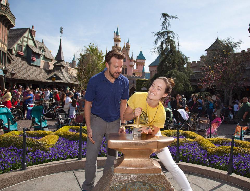 Jason Sudeikis and Olivia Wilde try removing the "Sword in the Stone" at Disneyland.